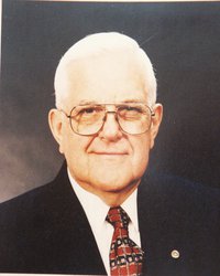 John R. “Johnnie”  Holmes